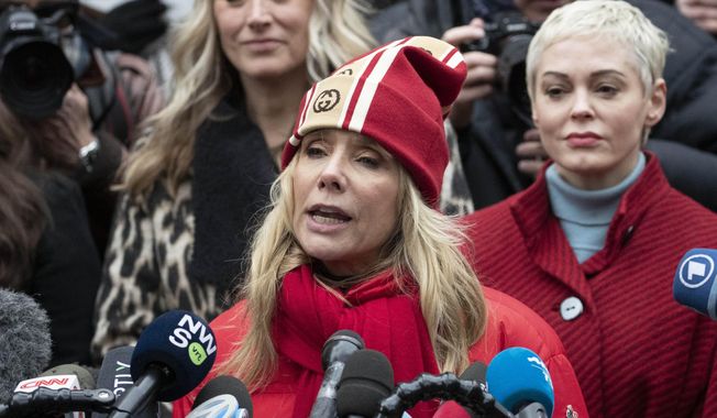 Actor Rosanna Arquette speaks as actor Rose McGowan, right,  listens at a news conference outside a Manhattan courthouse after the arrival of Harvey Weinstein, Monday, Jan. 6, 2020, in New York. Weinstein is on trial on charges of rape and sexual assault, more than two years after a torrent of women began accusing him of misconduct. (AP Photo/Mark Lennihan)