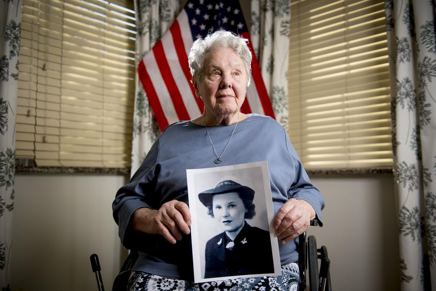 In this Wednesday, Feb. 19, 2020 photo, Olive O'Mara, a veteran who served as an engineer on a naval ship as part of the U.S. Navy's WAVES program during World War II, poses for a portrait at River Meadows Senior Living in Alpine, Utah. O'Mara was born on Saturday, Feb. 21, 1920. (Isaac Hale/The Daily Herald via AP)