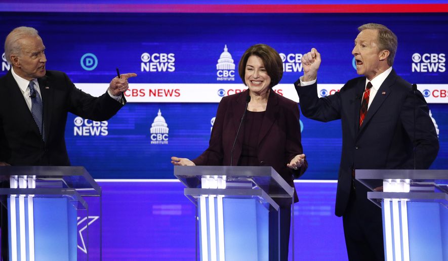 From left, Democratic presidential candidates, former Vice President Joe Biden, Sen. Amy Klobuchar, D-Minn., and businessman Tom Steyer, participate in a Democratic presidential primary debate at the Gaillard Center, Tuesday, Feb. 25, 2020, in Charleston, S.C., co-hosted by CBS News and the Congressional Black Caucus Institute. (AP Photo/Patrick Semansky)