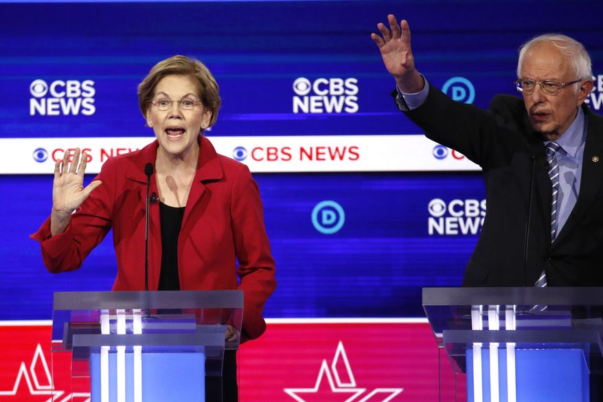 From left, Democratic presidential candidates, Sen. Elizabeth Warren, D-Mass., and Sen. Bernie Sanders, I-Vt., participate in a Democratic presidential primary debate at the Gaillard Center, Tuesday, Feb. 25, 2020, in Charleston, S.C., co-hosted by CBS News and the Congressional Black Caucus Institute. (AP Photo/Patrick Semansky)