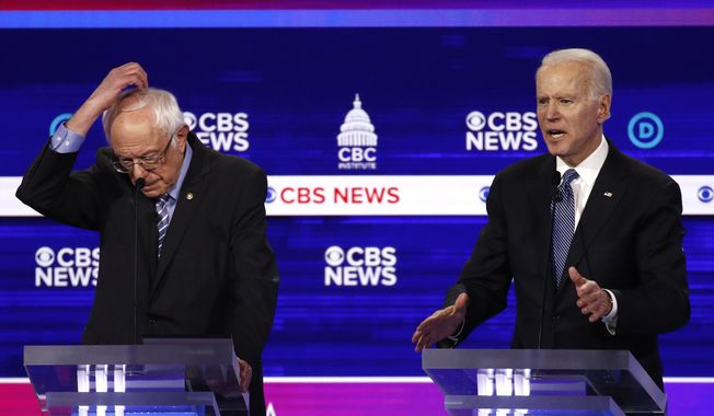 From left, Democratic presidential candidates Sen. Bernie Sanders, I-Vt., and former Vice President Joe Biden, participate in a Democratic presidential primary debate at the Gaillard Center, Tuesday, Feb. 25, 2020, in Charleston, S.C., co-hosted by CBS News and the Congressional Black Caucus Institute. (AP Photo/Patrick Semansky) ** FILE **