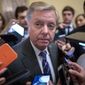 Senate Judiciary Committee Chairman Lindsey Graham, R-S.C., is surrounded by reporters after he and Republican lawmakers met with Attorney General William Barr about expiring provisions of the Foreign Intelligence Surveillance Act and other government intelligence laws, on Capitol Hill in Washington, Tuesday, Feb. 25, 2020. (AP Photo/J. Scott Applewhite)