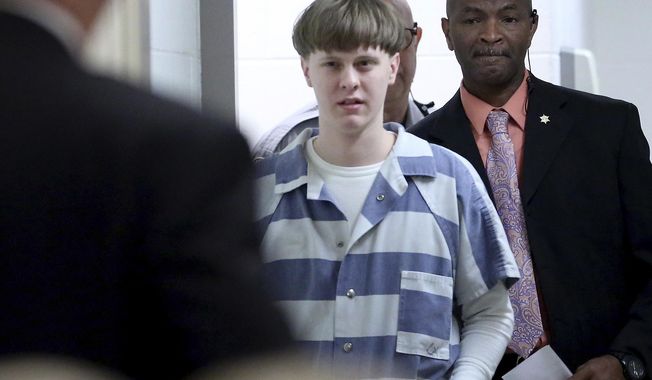 In this Monday, April 10, 2017, file photo, Dylann Roof arrives to a courtroom at the Charleston County Judicial Center in Charleston, S.C., to enter his guilty plea on murder charges. The white supremacist church shooter staged a hunger strike in February 2020 while on federal death row, alleging in letters to The Associated Press that he’s been “targeted by staff,” “verbally harassed and abused without cause” and “treated disproportionately harsh.” (Grace Beahm/The Post And Courier via AP, Pool, File)
