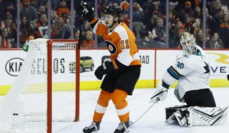 Philadelphia Flyers&#39; Travis Konecny (11) celebrates after scoring a goal against San Jose Sharks&#39; Aaron Dell (30) during the second period of an NHL hockey game, Tuesday, Feb. 25, 2020, in Philadelphia. (AP Photo/Matt Slocum)
