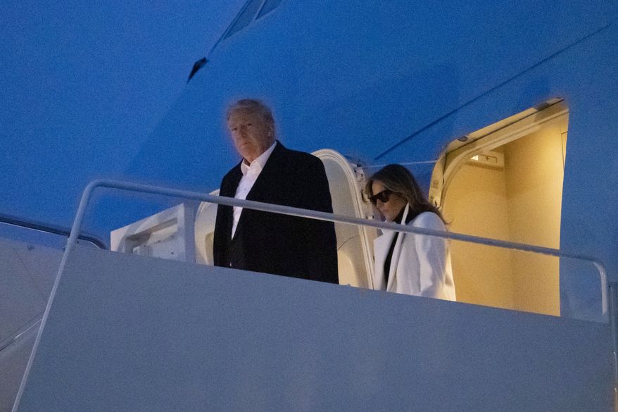 President Donald Trump, and first lady Melania Trump, step off Air Force One upon arrival, Wednesday, Feb. 26, 2020, at Andrews Air Force Base, Md. Mr. Trump is returning from India to fresh criticism from Democrats and in the media that his administration is ill-prepared for the ongoing coronavirus crisis. (AP Photo/Alex Brandon)