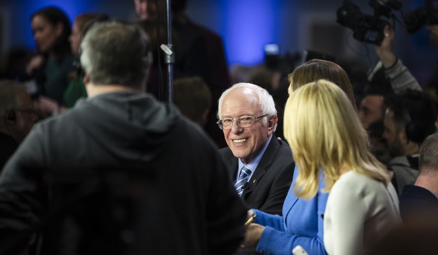 Democratic presidential candidate Sen. Bernie Sanders, I-Vt., speaks with members of the media after a Democratic presidential primary debate, Tuesday, Feb. 25, 2020, in Charleston, S.C. (AP Photo/Matt Rourke)
