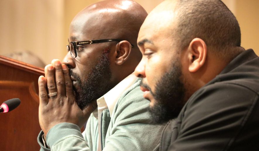 Eric Simmons (left) and Demetrius Smith, who were found innocent after spending years in prison for crimes they did not commit in Maryland, testify before state lawmakers for legislation to address how the wrongly incarcerated should be compensated by the state during a hearing Wednesday, Feb. 26, 2020 in Annapolis, Md. (AP Photo/Brian Witte)
