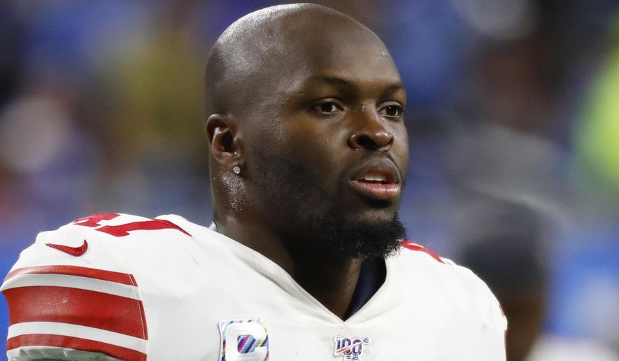 FILE - In this Oct. 27, 2019, file photo, New York Giants outside linebacker Alec Ogletree watches during an NFL football game against the Detroit Lions in Detroit. The New York Giants released linebackers Alec Ogletree and Kareem Martin, clearing significant salary cap space Wednesday, Feb. 26, 2020, with the departure of their two most expensive defensive players. (AP Photo/Paul Sancya, File)