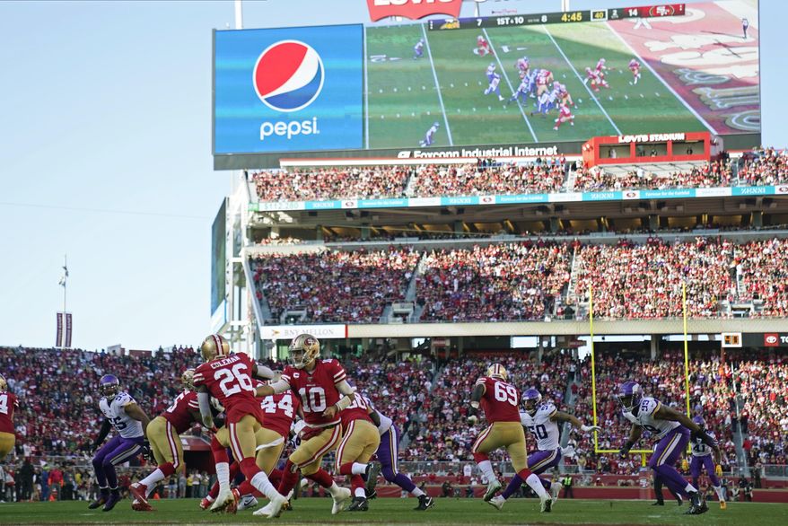 FILE - In this Jan. 11, 2020, file photo, San Francisco 49ers quarterback Jimmy Garoppolo (10) hands off to running back Tevin Coleman (26) during the first half of an NFL divisional playoff football game against the Minnesota Vikings at Levi's Stadium in Santa Clara, Calif. The current collective bargaining agreement expires in March 2021, but NFL owners are eager to get a new contract in place as soon as possible. That would enable them to begin looking toward new, lucrative broadcast deals, with a decade of labor peace assured. But the players don't appear to be in a rush to approve the new agreement that is the result of 10 months of negotiations between the sides. Indeed, several player reps last Friday night were adamant that more negotiating is needed. (AP Photo/Tony Avelar, File)