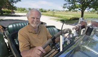 This 2007 image released by G.P. Putnam&#39;s Sons shows author Clive Cussler riding in a classic car. Cussler died on Monday, Feb. 24, 2020 at his home in Scottsdale, AZ. He was 88. (Ronnie Bramhall/G.P. Putnam&#39;s Sons via AP)