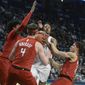 Penn State&#39;s Lamar Stevens (11) is fouled by Rutgers Ron Harper Jr., right, and Paul Mulcahy, center, during the first half of an NCAA college basketball game, Wednesday, Feb. 26, 2020, in State College, Pa. (AP Photo/Gary M. Baranec)