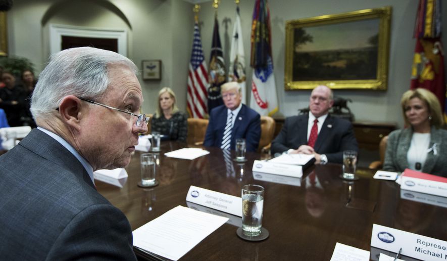 FILE - In this Tuesday, March 20, 2018 file photo, Attorney General Jeff Sessions, left, speaks during a roundtable talks on sanctuary cities hosted by President Donald Trump, third from right, in the Roosevelt Room of the White House, in Washington. The Trump administration can withhold millions of dollars in law enforcement grants to force states to cooperate with U.S. immigration enforcement, a federal appeals court in New York ruled Wednesday, Feb. 26, 2020 in a decision that conflicted with three other federal appeals courts. (AP Photo/Manuel Balce Ceneta)