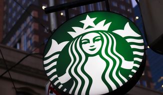 This June 26, 2019, photo shows a Starbucks sign outside a Starbucks coffee shop in downtown Pittsburgh. Starbucks customers in Canada will soon be able to down fake meat with their Frappuccinos. The coffee chain said Wednesday, Feb. 26, 2020, that it will soon start selling a sandwich featuring a meat-free patty from Beyond Meat, the El Segundo, California-based company whose patties are already found at other fast food chains. (AP Photo/Gene J. Puskar)