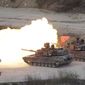 FILE - In this April 26, 2017, file photo, U.S. Army&#39;s M1 A2 tanks fire during South Korea-U.S. joint military live-fire drills at Seungjin Fire Training Field in Pocheon, South Korea, near the border with North Korea. The South Korean and U.S. militaries have postponed on Thursday, Feb. 27, 2020, their annual joint drills out of concerns over a virus outbreak. (AP Photo/Ahn Young-joon, File)