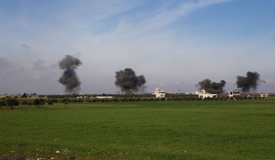 Columns of smoke rise after airstrikes hit the Idlib province, Syria, on Thursday. Nearly three dozen Turkish soldiers were killed during a Syrian airstrike causing a sharp escalation in a growing conflict between the two countries. (ASSOCIATED PRESS )