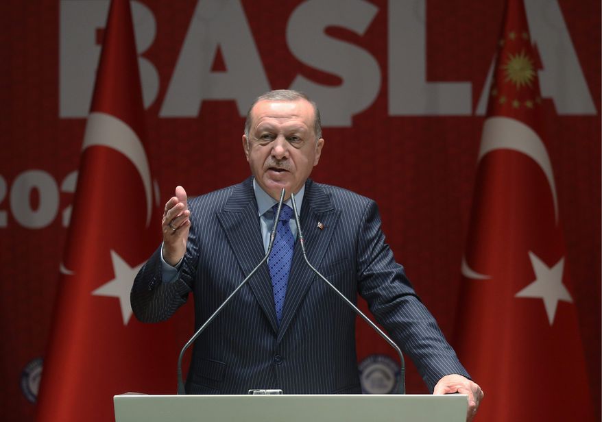 Turkish President Recep Tayyip Erdogan speaks to his ruling party members, in Ankara, Turkey, Thursday, Feb. 27, 2020. Erdogan said Thursday that fighting in northwest Syria had swung in favor of Turkey and the opposition forces it supports. (Presidential Press Service via AP, Pool)