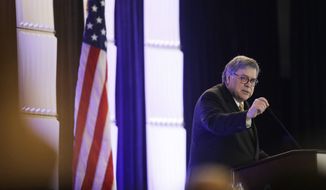 Attorney General William Barr speaks at the International Association of Chiefs of Police Officer Safety and Wellness Symposium on Thursday, Feb. 27, 2020, in Miami. (AP Photo/Brynn Anderson)