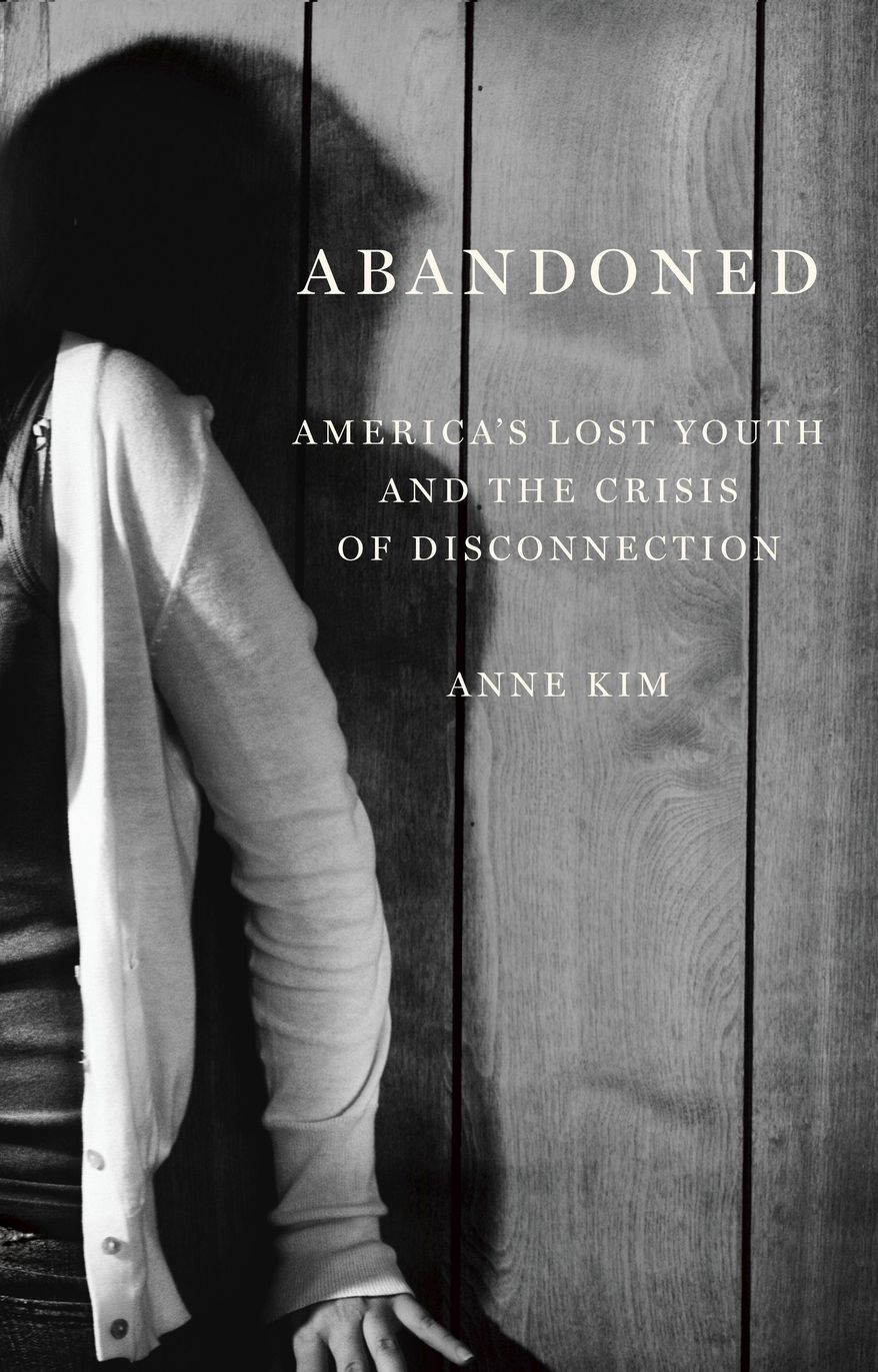 This cover image released by The New Press shows "Abandoned: America’s Lost Youth and the Crisis of Disconnection" by Anne Kim. (The New Press via AP)