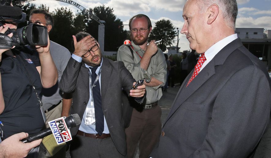 FILE- In this Wednesday, Sept. 30, 2015 file photo, federal public defender Dale Baich, right, one of the attorneys for death row inmate Richard Glossip, talks with the media outside the Oklahoma State Penitentiary in McAlester, Okla. Oklahoma is ill-prepared to resume executing inmates and its new lethal injection protocols would violate the constitutional rights of prisoners, attorneys for death row inmates said in a court filing on Thursday, Feb 27, 2020. (AP Photo/Sue Ogrocki)