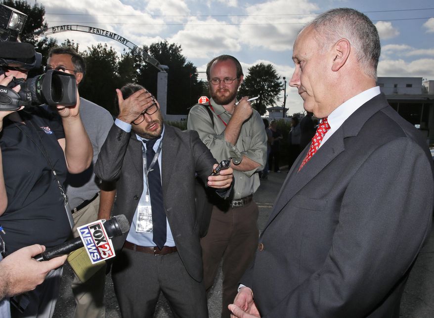 FILE- In this Wednesday, Sept. 30, 2015 file photo, federal public defender Dale Baich, right, one of the attorneys for death row inmate Richard Glossip, talks with the media outside the Oklahoma State Penitentiary in McAlester, Okla. Oklahoma is ill-prepared to resume executing inmates and its new lethal injection protocols would violate the constitutional rights of prisoners, attorneys for death row inmates said in a court filing on Thursday, Feb 27, 2020. (AP Photo/Sue Ogrocki)
