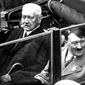 In this May 1, 1933 file photo German President Paul von Hindenburg, left, and Adolf Hitler, right, sit in a car during a labor day celebration in Berlin. The Berlin state government on Thursday struck the Prussian aristocrat Paul von Hindenburg off of its honorary citizen list, citing his act as president in 1933 of appointing Hitler as chancellor, the dpa news agency reported. Hindenburg was elected president in 1925 and served in that role until his death in 1934. (AP Photo)