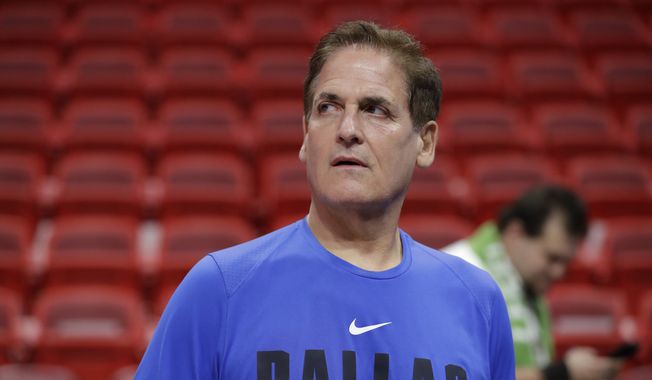 Dallas Mavericks owner Mark Cuban watches players warm up before the start of an NBA basketball game against the Miami Heat, Friday, Feb. 28, 2020, in Miami. (AP Photo/Wilfredo Lee) ** FILE **