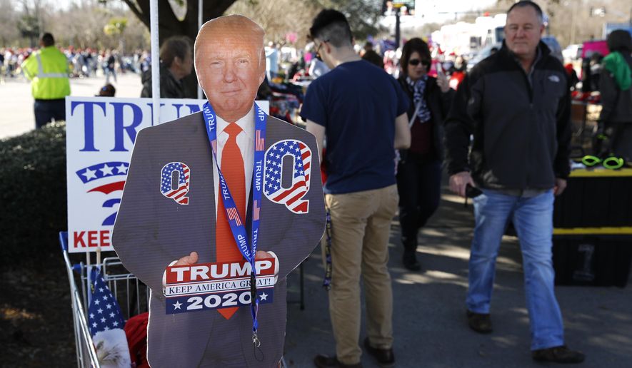 Attendees gather outside a campaign rally for President Donald Trump, Friday, Feb. 28, 2020, in North Charleston, S.C. (AP Photo/Patrick Semansky)