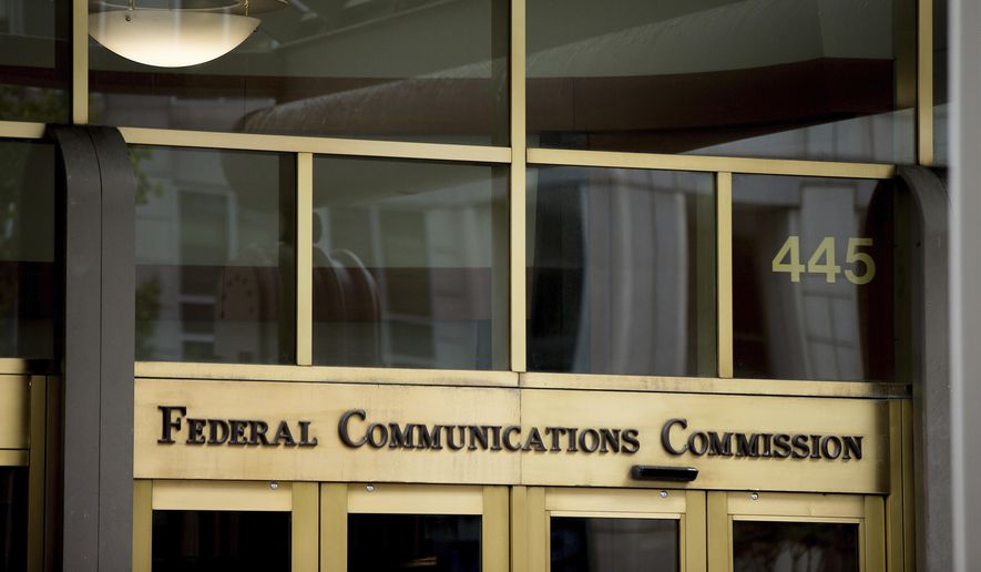 This June 19, 2015, file photo, shows the Federal Communications Commission building in Washington. (AP Photo/Andrew Harnik, File)