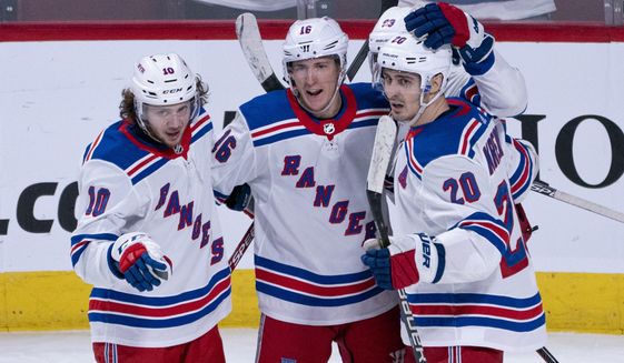 New York Rangers&#39; Ryan Strome, center, celebrates his goal against the Montreal Canadiens with teammates Artemi Panarin, left, and Chris Kreider during the third period of an NHL hockey game Thursday, Feb. 27, 2020, in Montreal. (Paul Chiasson/The Canadian Press via AP)