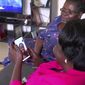 In this image taken from video, Margaret Ntale, whose three student daughters are stranded in Wuhan, and Cecilia Oyet, in foreground holding cellphone, whose daughter is a medical student at Wuhan University of Science and Technology, speak by video-call to their children and other Ugandan students who are stranded in Wuhan, from Ntale&#39;s house in Kampala, Uganda on Thursday, Feb. 27, 2020. Parents&#39; fears are growing for the thousands of African students who are thought to be stranded in China&#39;s locked-down city of Wuhan amid the virus outbreak, with concerns that students are running out of food and money weeks after other countries evacuated citizens. (AP Photo)