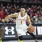 Maryland guard Anthony Cowan Jr. (1) drives to the basket against Michigan State guard Rocket Watts (2) during the second half of an NCAA college basketball game Saturday, Feb. 29, 2020, in College Park, Md. (AP Photo/Terrance Williams) **FILE**