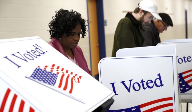 Voters fill out their ballots at a primary polling place, Saturday, Feb. 29, 2020, in Charleston, S.C. (AP Photo/Patrick Semansky)