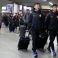 Players of the Chinese Super League team Wuhan Zall arrive at the Atocha train station in Madrid, Spain, Saturday, Feb. 29, 2020. The Chinese first-division soccer club from the city of Wuhan enters its second month in Spain without knowing when it will be able to return home. . It hasn&#39;t been easy for the nearly 50 members of the Wuhan Zall squad, but on Sunday they will get some reprieve from their ordeal by attending the Spanish league &amp;quot;clasico&amp;quot; between Real Madrid and Barcelona at the Santiago Bernabeu Stadium in Madrid. (AP Photo/Manu Fernandez)