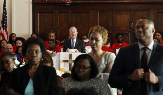 Members turn their backs on Mayor Michael Bloomberg as he speaks at Brown Chapel AME church in protest Sunday, March 1, 2020, in Selma , Ala. (AP Photo/Butch Dill)