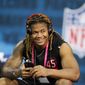 Ohio State defensive lineman Chase Young watches a drill at the NFL football scouting combine in Indianapolis, Saturday, Feb. 29, 2020. (AP Photo/Charlie Neibergall) **FILE**