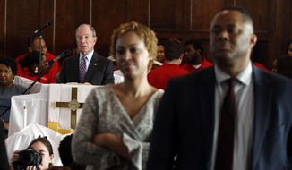 Members turn their backs on Mayor Michael Bloomberg in protest as he speaks at Brown Chapel AME church Sunday, March 1, 2020, in Selma, Ala. (AP Photo/Butch Dill)