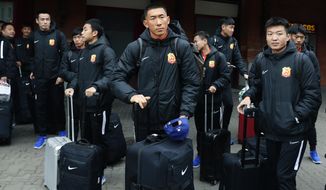 Players of the Chinese Super League team Wuhan Zall arrive at the Atocha train station in Madrid, Spain, Saturday, Feb. 29, 2020. The Chinese first-division soccer club from the city of Wuhan enters its second month in Spain without knowing when it will be able to return home. . It hasn&#39;t been easy for the nearly 50 members of the Wuhan Zall squad, but on Sunday they will get some reprieve from their ordeal by attending the Spanish league &amp;quot;clasico&amp;quot; between Real Madrid and Barcelona at the Santiago Bernabeu Stadium in Madrid. (AP Photo/Manu Fernandez)