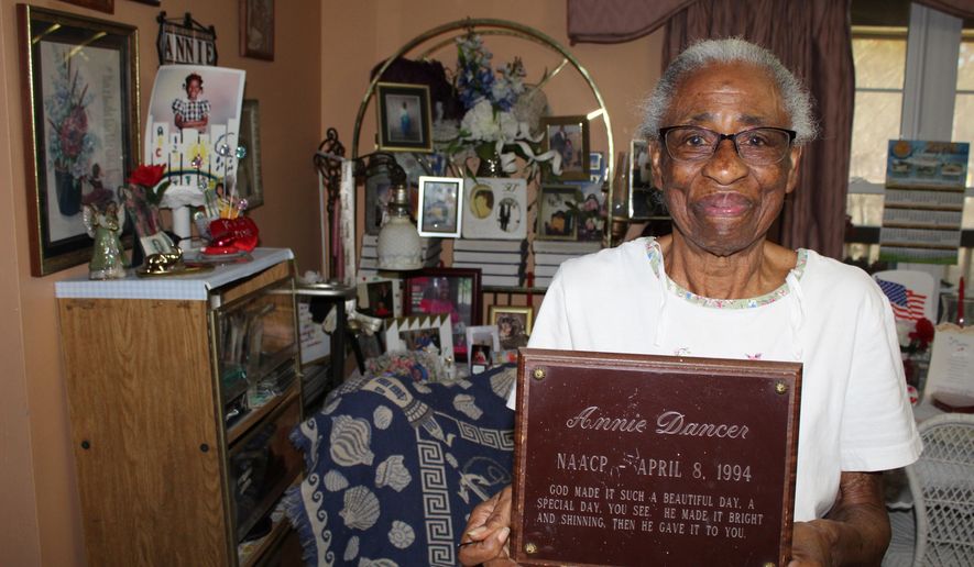 Annie Dancer, 89, holds up a plaque she received in 1994 from the Oktibbeha County NAACP, of which she is a lifelong member, in her house on Saturday, Feb. 22, 2020. Dancer was an active participant in the Civil Rights Movement of the 1960s and marched in Washington D.C. with fellow Oktibbeha County NAACP members. She continues to march in Starkville's annual Martin Luther King Jr. Day march. (Tess Vrbin/The Commercial Dispatch via AP)
