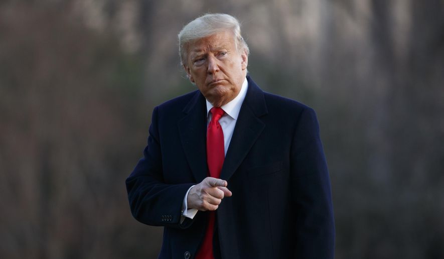 President Donald Trump points to the media as he arrives at the White House in Washington, Saturday, Feb. 29, 2020, on Marine One as he returns from speaking at the Conservative Political Action Conference (CPAC). (AP Photo/Carolyn Kaster)
