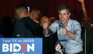 Former Texas Rep. Beto O&#39;Rourke gestures after endorsing Democratic presidential candidate former Vice President Joe Biden at a campaign rally Monday, March 2, 2020 in Dallas. (AP Photo/Richard W. Rodriguez)