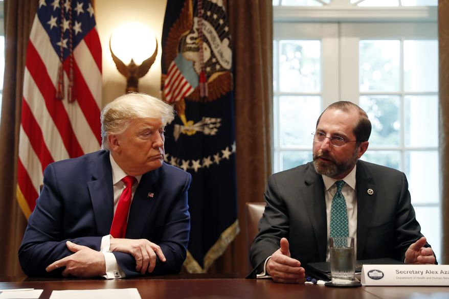 President Donald Trump listens to Health and Human Services Secretary Alex Azar as they meet with pharmaceutical executives in the Cabinet Room of the White House, Monday, March 2, 2020, in Washington. (AP Photo/Andrew Harnik)