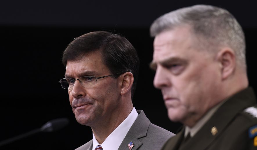 Defense Secretary Mark Esper, left, and Chairman of the Joint Chiefs of Staff Army Gen. Mark Milley, right, during a briefing at the Pentagon in Washington, Monday, March 2, 2020. (AP Photo/Susan Walsh)