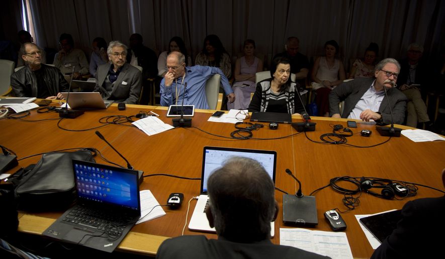 Cuban and foreign scientists and health professionals meet in Havana, Cuba, Monday, March 2, 2020 to evaluate the possibility that pesticides were responsible for symptoms, such as hearing loss and headaches, suffered by U.S. and Canadian diplomats two years ago. From left are Mark Cohen from UCLA's psychology department, Robert Bartholomew an American medical sociologist, Alon Friedman from Dalhousie University’s medical school, Beatrice Golomb from California University’s medical school, and Mark M. Rasenick from University of Illinois medical school. (AP Photo/Ismael Francisco)