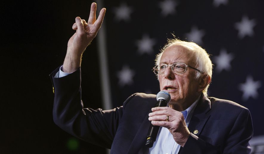 FILE - In this Sunday, March 1, 2020, file photo, Democratic presidential candidate Sen. Bernie Sanders, I-Vt., waves at supporters at a campaign event at Los Angeles Convention Center in Los Angeles. Sanders is the favorite in Tuesday's California primary, but he'll be tested in a reordered Democratic race. Four years after a bitter loss in California's presidential primary, Bernie Sanders appears on track for an impressive showing in Tuesday's election in what would be a capstone moment for the state's progressive wing. (AP Photo/Damian Dovarganes, File)