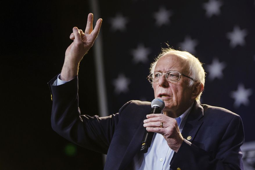 FILE - In this Sunday, March 1, 2020, file photo, Democratic presidential candidate Sen. Bernie Sanders, I-Vt., waves at supporters at a campaign event at Los Angeles Convention Center in Los Angeles. Sanders is the favorite in Tuesday's California primary, but he'll be tested in a reordered Democratic race. Four years after a bitter loss in California's presidential primary, Bernie Sanders appears on track for an impressive showing in Tuesday's election in what would be a capstone moment for the state's progressive wing. (AP Photo/Damian Dovarganes, File)