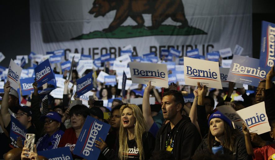 Supporters cheer for Democratic presidential candidate Sen. Bernie Sanders, I-Vt., as he speaks at a campaign event at Los Angeles Convention Center in Los Angeles Sunday, March 1, 2020. (AP Photo/Damian Dovarganes)