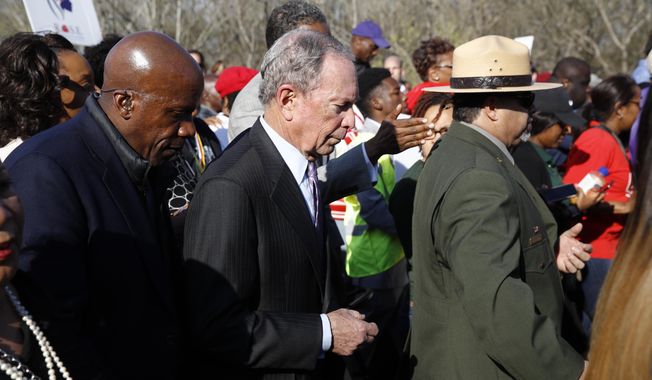Democratic presidential candidate Mike Bloomberg walks across the Edmund Pettus Bridge in Selma, Ala., Sunday, March 1, 2020, to commemorate the 55th anniversary of &amp;quot;Bloody Sunday,&amp;quot; when white police attacked black marchers in Selma. (AP Photo/Patrick Semansky)