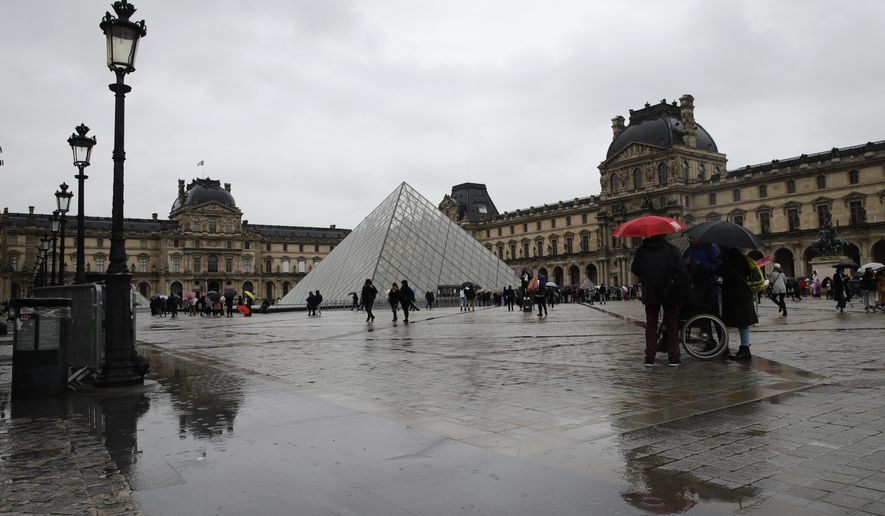 The Louvre museum is pictured in Paris, Monday, March 2, 2020. The Louvre Museum was closed again Monday as management was meeting with staff worried about the spread of the new virus in the world&#39;s most-visited museum. (AP Photo/Christophe Ena)