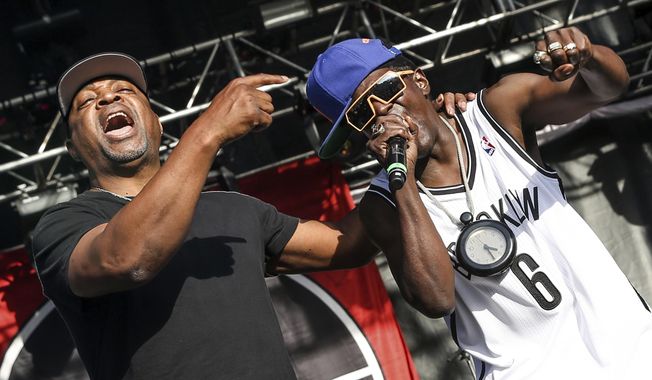 This May 29, 2015, file photo shows Chuck D, left, Flavor Flav of Public Enemy performing at the 2015 BottleRock Napa Valley Music Festival in Napa, Calif. (Photo by Rich Fury/Invision/AP, File)