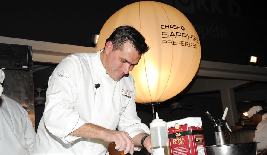 IMAGE DISTRIBUTED FOR CHASE SAPPHIRE - Chef Todd English participates in the Chase Sapphire Preferred Grill Challenge during Vegas Uncork&#39;d by Bon Appetit, at the Bellagio on Saturday, May 11, 2013 in Las Vegas. (Photo by Evan Agostini/Invision for Chase Sapphire/AP) **FILE**


